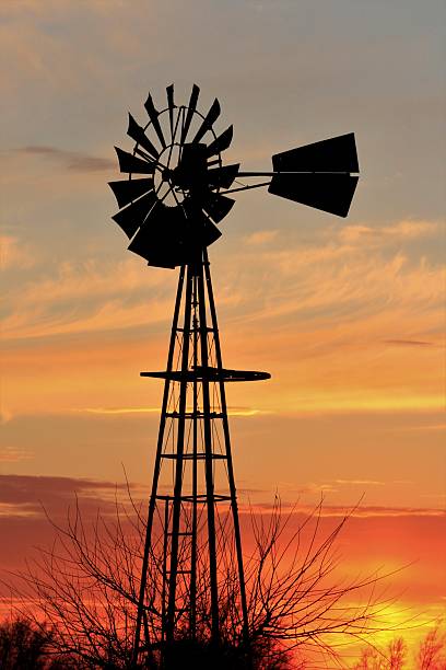 Kansas colorful Sky with Windmill silhouette. That's North of Hutchinson Kansas USA.