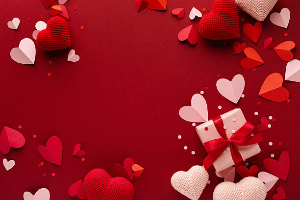 istock Gift box decorated with various love hearts on red frame blank background. Valentine Day greeting card template. 2254560680