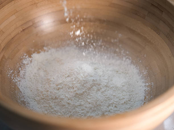 istock Sifting flour into a wooden bowl 2254564204