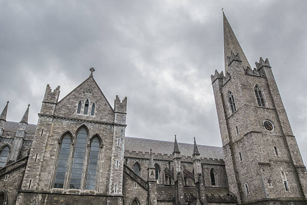 Exterior of St Patrick's Cathedral in Dublin, Ireland against a cloudy sky