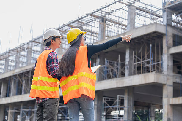 istock Construction workers assessing site progress urban development photo outdoor eye-level collaboration 2254576499
