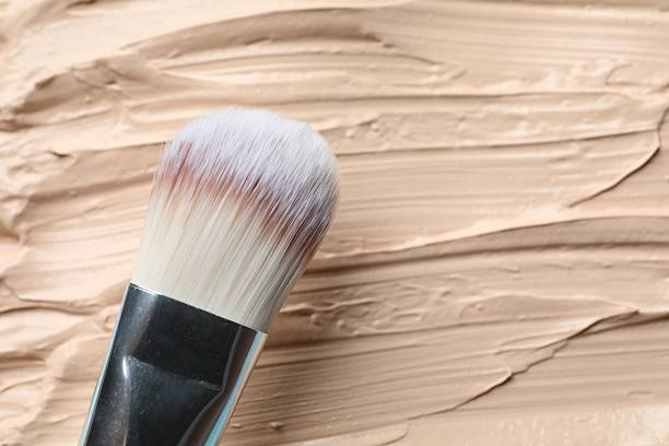 istock Liquid texture foundation with brush. Makeup base, BB cream, smear background 2254576929