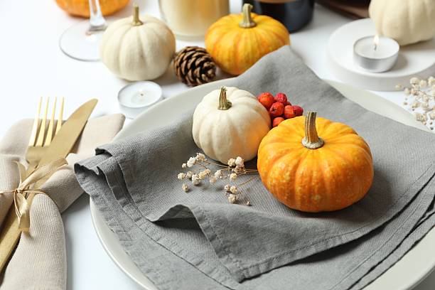 istock Rustic holiday table setup with plates, cutlery and autumn decorations. Empty space for your text 2254577050