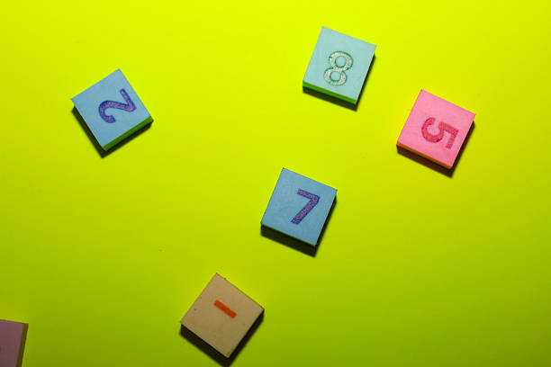 Colorful 123 numbers created from modeling clay on light blue table background. Pastel color. Time to learning. Closeup. Top down view.