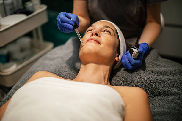 istock Applying facial mask at beauty spa 2254578951