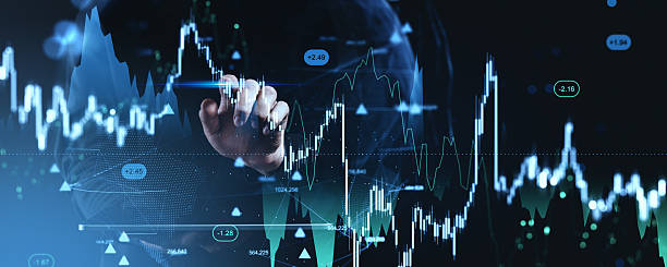 istock Futuristic trading concept with hand interacting with holographic forex and cryptocurrency charts on digital background displaying data points. 2254579827