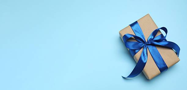 istock Beautiful gift box on blue background, top view 2254579987