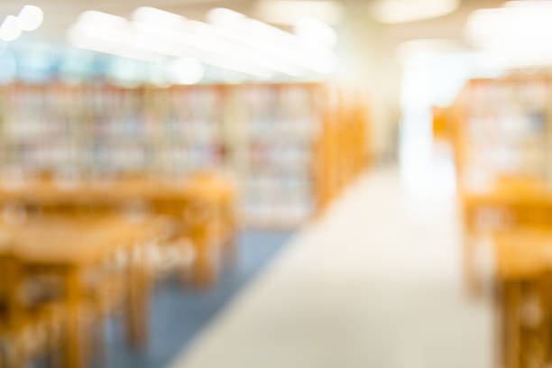Blur library with book shelves and tables