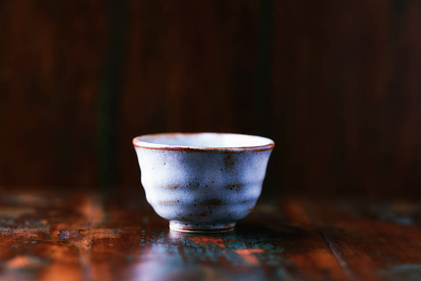 Traditional japanese ceramic on rustic wooden background. Soft focus. Copy space.