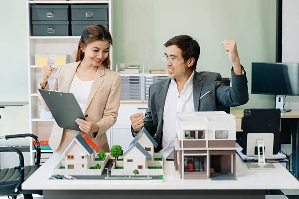 istock Modern office meeting of architects, designers, and developers creating innovative, sustainable housing projects 2254584241