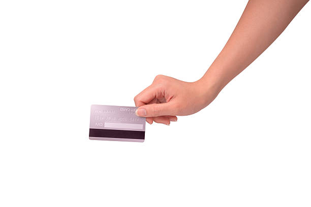 istock Hand holding a credit card isolated on white background. High resolution, high quality studio shot. Concept for technology, business, finance, advertising, E-commerce, Shopping and lifestyle themes. 2254587086