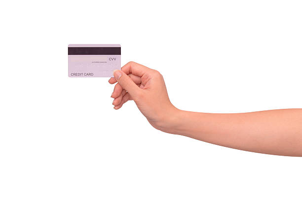 istock Hand holding a credit card isolated on white background. High resolution, high quality studio shot. Concept for technology, business, finance, advertising, E-commerce, Shopping and lifestyle themes. 2254587110