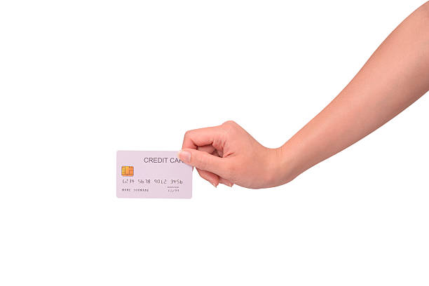 istock Hand holding a credit card isolated on white background. High resolution, high quality studio shot. Concept for technology, business, finance, advertising, E-commerce, Shopping and lifestyle themes. 2254587157
