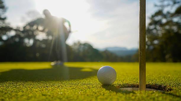 istock Golfers are playing golf in the evening golf course golf backglound. 2254588418