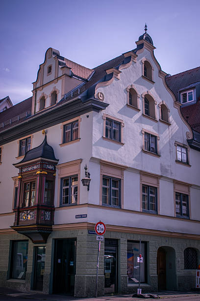 Traditional Bavarian architecture building in the old town of Memmingen, Germany. Classic European facade with ornate details, pastel colors and historic charm under a clear summer sky. Travel and tourism destination in southern Germany.
