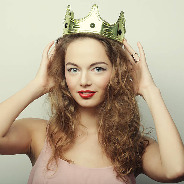 istock young blond woman in crown 2254593403