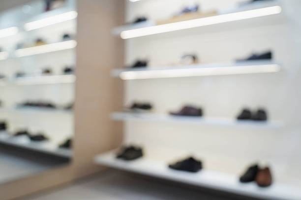 Sport Shoes on shelves in the shoes store blur for background