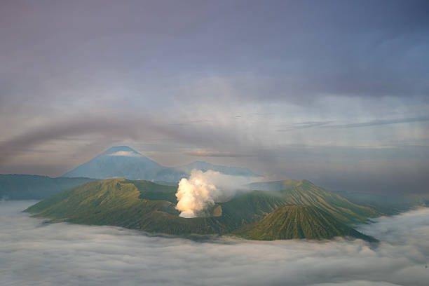 Mount Bromo at dawn amidst mist and smoke, East Java, Indonesia