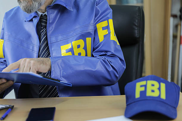 istock Experienced FBI Agent Studying Investigation Papers 2254595297