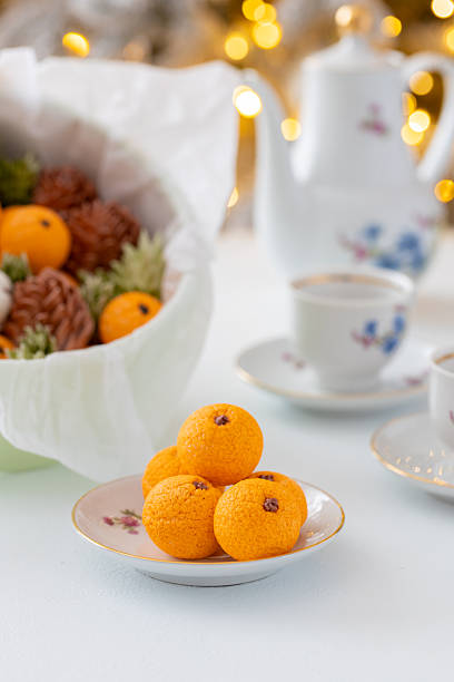 istock Zephyr arrangement featuring pine cones, cotton bolls, and oranges nestled in white tissue paper, creating a festive atmosphere with natural elements and seasonal charm 2254596292