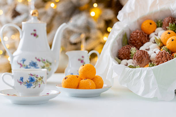 istock Zephyr arrangement featuring pine cones, cotton bolls, and oranges nestled in white tissue paper, creating a festive atmosphere with natural elements and seasonal charm 2254596295