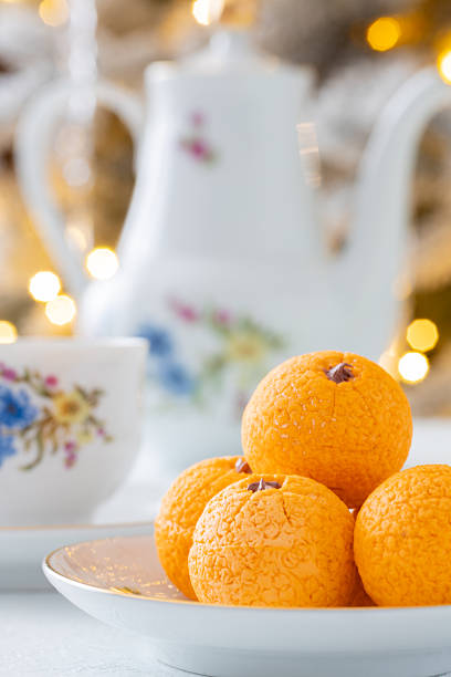 istock Zephyr arrangement featuring pine cones, cotton bolls, and oranges nestled in white tissue paper, creating a festive atmosphere with natural elements and seasonal charm 2254596300