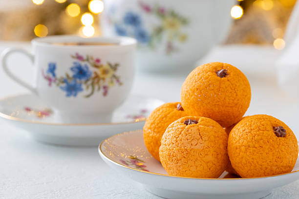 istock Zephyr arrangement featuring pine cones, cotton bolls, and oranges nestled in white tissue paper, creating a festive atmosphere with natural elements and seasonal charm 2254596307