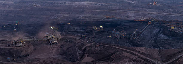 istock Ultra high resolution panoramic view of massive mining machines. 2254596392