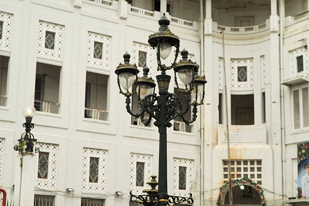 Vintage Lanterns Framed by Geometric and Floral Architecture
