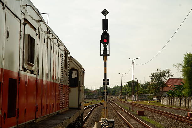 Train Station Scene with Red Signal and Track Junction