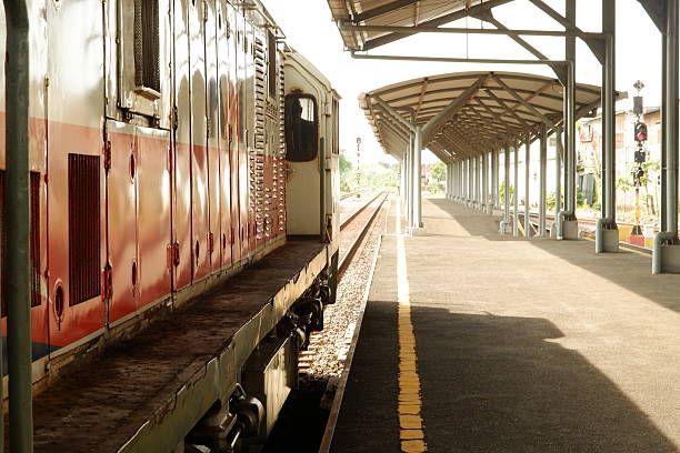 Stationary Train at Platform with Yellow Safety Line