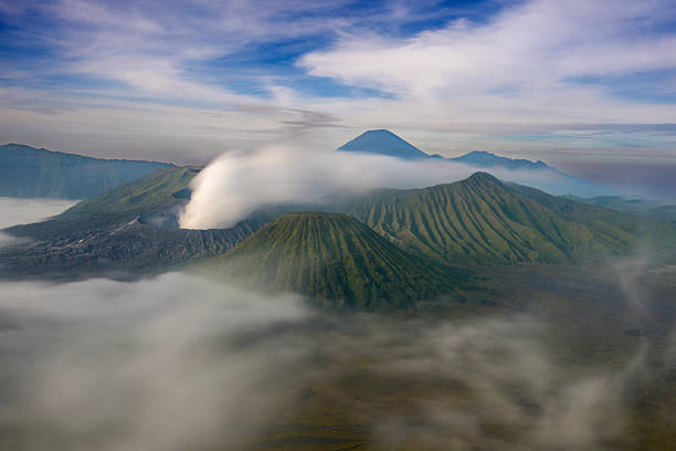 Mount Bromo at dawn amidst mist and smoke, East Java, Indonesia
