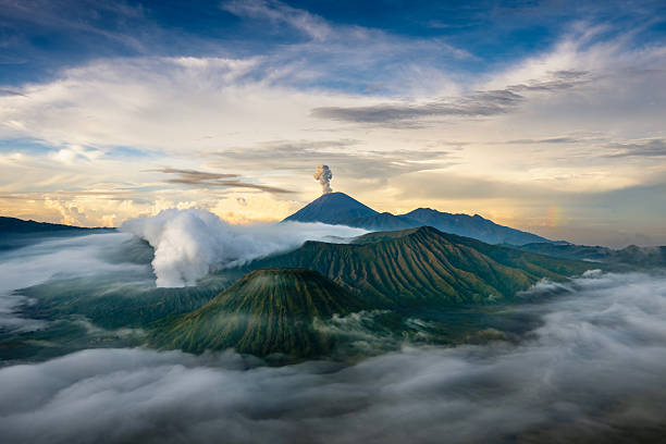 The beauty of Mount Rinjani Peak surrounded by clouds with Segara Anak Lake seen from a height. Mount Rinjani is an active volcano in East Lombok, West Nusa Tenggara, Indonesia.