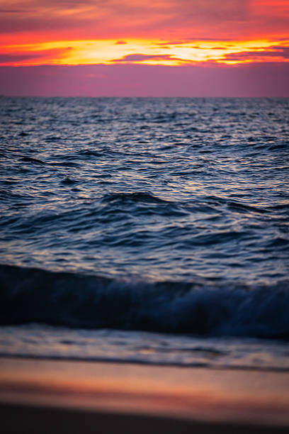 istock Sea waves on the beach at sunset. 2254603608