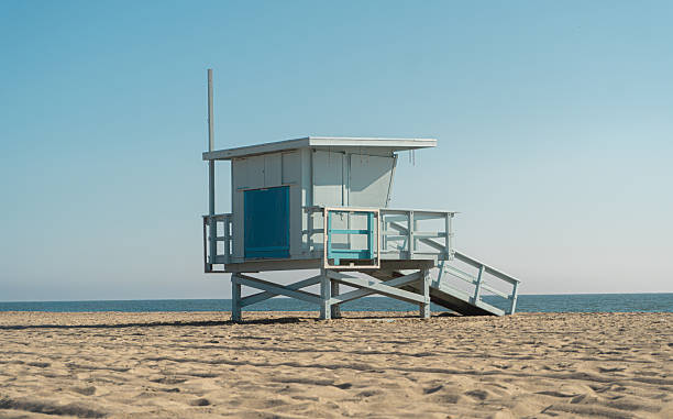 istock Minimalist White Lifeguard Tower on Sunny Beach 2254605174