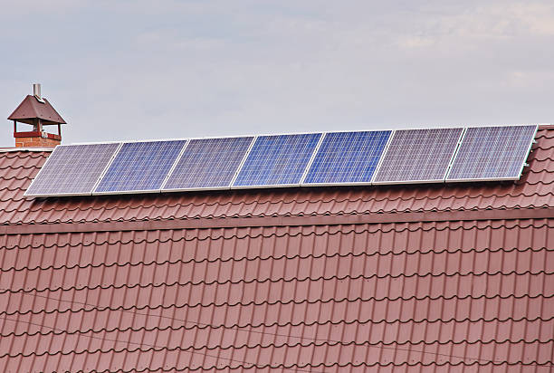 Solar panels on the house roof, environmentally friendly energy from the sun.