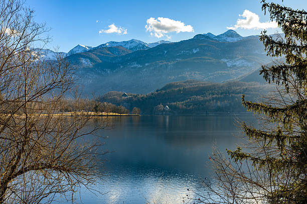 Scenic landscape view across Lake Bohinj with blue sky