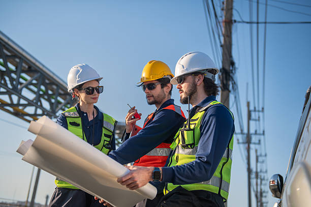 istock Engineers Reviewing Construction Plans at Industrial Gas Storage Facility, Industrial engineer inspecting petrochemical facility construction blueprint at gas storage plant site. 2254617389