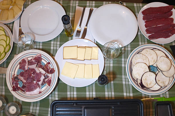 sliced cheese pieces for a traditional raclette lunch