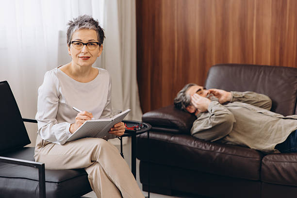 istock Psychologist counseling patient on a comfortable sofa 2254618765
