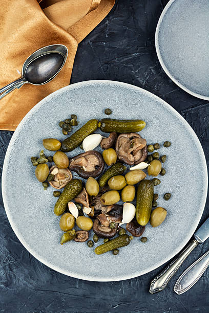 istock salted cucumbers, marinated mushrooms and olives 2254619720