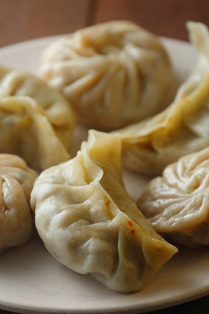 istock Steamed Momos Assortment on White Plate 2254619974