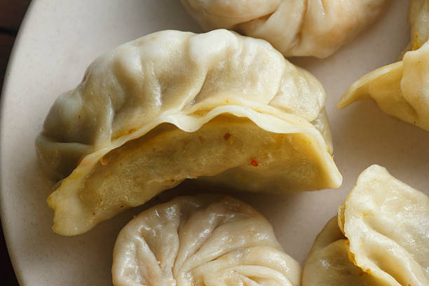 istock Steamed Momos Assortment on White Plate 2254620135