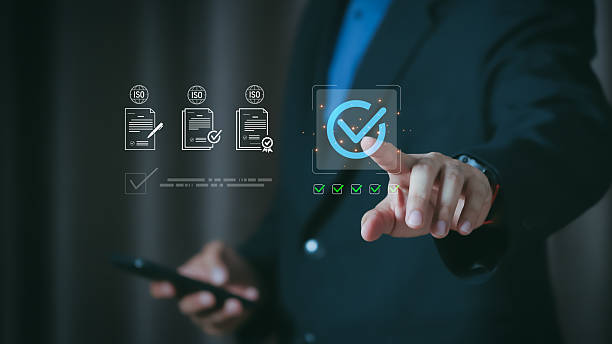 istock Businessman hand touching virtual checkmark for ISO certification process. Concept of global quality management system, standard control assurance, and warranty service for business success. 2254620920