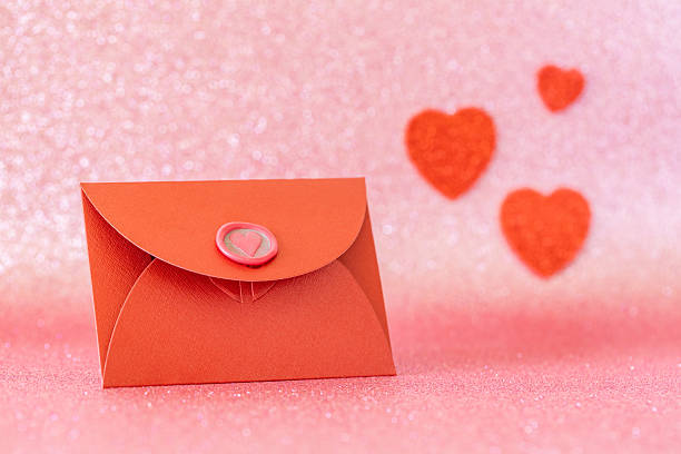 Romantic background. Red envelope with a love confession, Valentine's heart. A declaration of love to the closest person. Mother's Day, wedding anniversary, birthday