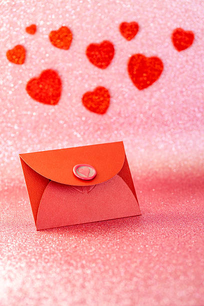 istock Romantic background. Red envelope with a love confession, Valentine's heart. A declaration of love to the closest person. Mother's Day, wedding anniversary, birthday. Vertical 2254623716