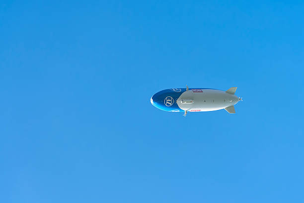 Bregenz, Austria – August 18, 2025: Airship, Zeppelin over Lake Constance near Bregenz. Space for text on the left side of the image.