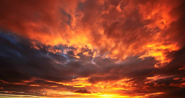 Wonderful sky replacement of some clouds at sunset time, that look like they are on fire.