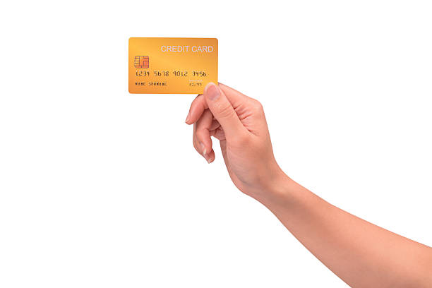 istock Hand holding a credit card isolated on white background. High resolution, high quality studio shot. Concept for technology, business, finance, advertising, E-commerce, Shopping and lifestyle themes. 2254626050