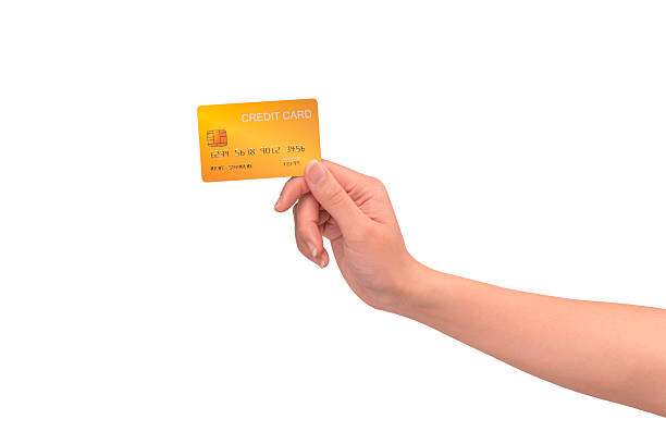 istock Hand holding a credit card isolated on white background. High resolution, high quality studio shot. Concept for technology, business, finance, advertising, E-commerce, Shopping and lifestyle themes. 2254626063